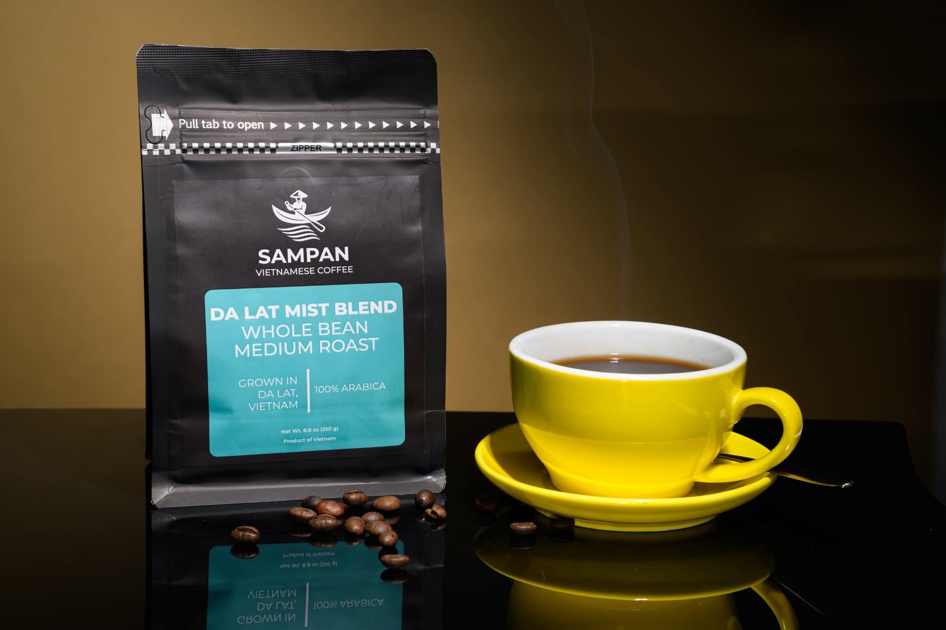 Sampan Da Lat Mist Blend coffee bag standing beside a yellow cup of brewed Vietn