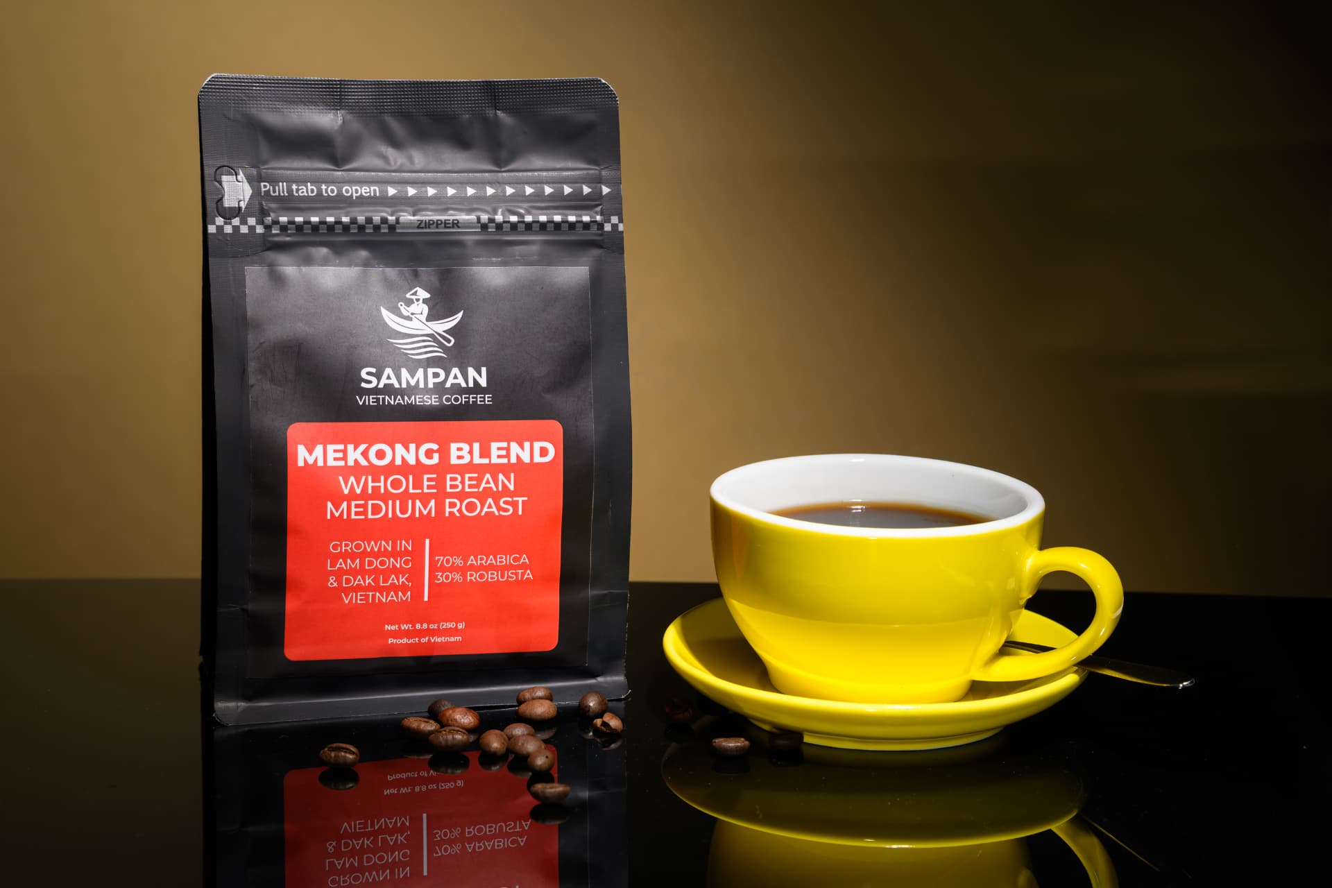 Sampan Mekong Blend coffee bag standing beside a yellow cup of brewed Vietnamese