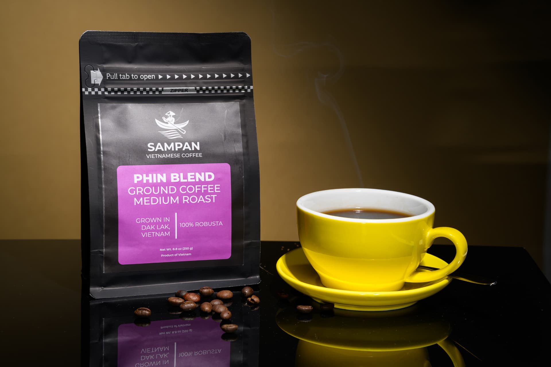 Sampan Phin Blend coffee bag standing beside a yellow cup of brewed Vietnamese c